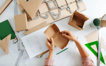 hands working on box mockup