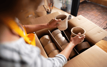 woman unpacking sustainable packaging